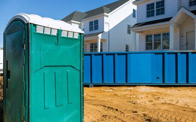 dumpster and portable toilet at a construction site in Bonita Springs FL